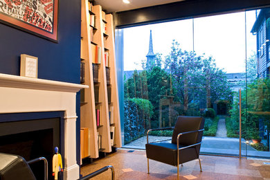 Living room - mid-sized contemporary formal cork floor living room idea in DC Metro with blue walls, a standard fireplace and a wood fireplace surround