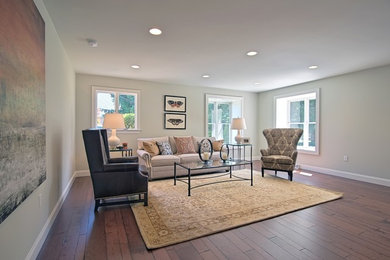 Example of a mid-sized transitional formal and open concept dark wood floor and brown floor living room design in Philadelphia with gray walls, no fireplace and no tv