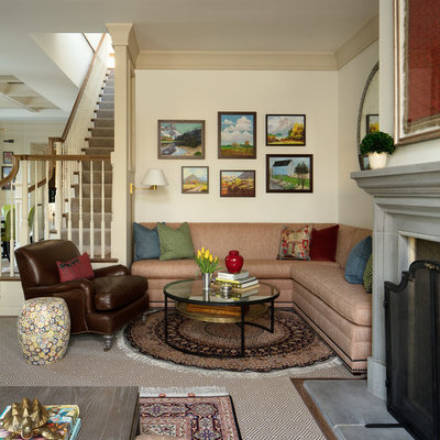 Living room - large traditional open concept medium tone wood floor and brown floor living room idea in Chicago with beige walls and a standard fireplace