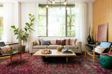 Inspiration for a bohemian living room in Boston with white walls.