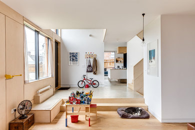 Inspiration for a mid-sized scandinavian open concept light wood floor living room remodel in Buckinghamshire with beige walls