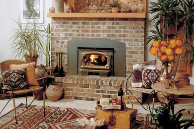 Living room - mid-sized traditional formal and enclosed carpeted and beige floor living room idea in Other with beige walls, a standard fireplace, a brick fireplace and no tv