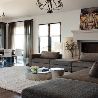 Inspiration for a large contemporary open concept dark wood floor and brown floor living room remodel in San Francisco with white walls, a standard fireplace and a stone fireplace