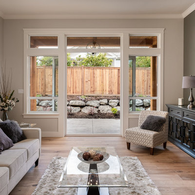 Living room - mid-sized transitional formal and enclosed light wood floor and brown floor living room idea in Other with beige walls, a standard fireplace, a stone fireplace and no tv