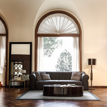 Lounge with huge arched window and Signorini & Coco furniture