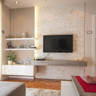 Example of a trendy medium tone wood floor living room design in Other with beige walls and a wall-mounted tv
