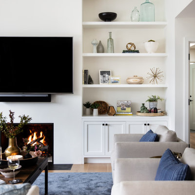 Living room - large transitional open concept beige floor living room idea in San Francisco with white walls, a standard fireplace and a wall-mounted tv