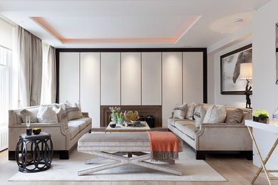 This is an example of a contemporary formal enclosed living room in London with beige walls and light hardwood flooring.