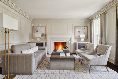 Living room - transitional dark wood floor and brown floor living room idea in New York with beige walls and a standard fireplace