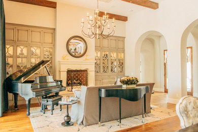 This is an example of a large traditional formal open plan living room in Phoenix with grey walls, medium hardwood flooring, a standard fireplace, a stone fireplace surround and no tv.