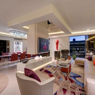 This is an example of a modern formal open plan living room in Devon with beige walls, a standard fireplace and beige floors.