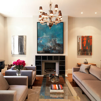 Living room - transitional formal medium tone wood floor living room idea in London with beige walls and a standard fireplace