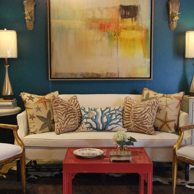 Example of an eclectic living room design in Other with blue walls