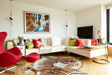 Inspiration for a transitional light wood floor living room remodel in New York with white walls