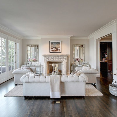 Example of a large transitional enclosed dark wood floor living room design in Seattle with a music area, beige walls, a standard fireplace, a plaster fireplace and no tv