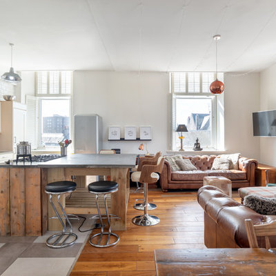 Inspiration for a large industrial ceramic tile living room remodel in Other