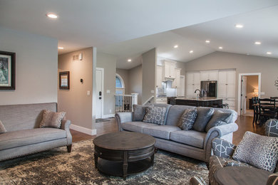 Photo of a medium sized traditional open plan living room in Wichita with beige walls and medium hardwood flooring.