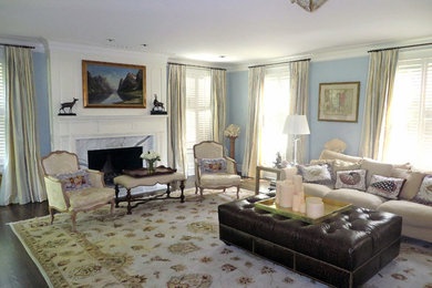 Photo of a large traditional open plan living room in Baltimore with blue walls, dark hardwood flooring, a standard fireplace and a stone fireplace surround.