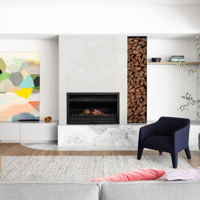 Example of a trendy open concept medium tone wood floor and brown floor living room design in Melbourne with white walls and a standard fireplace