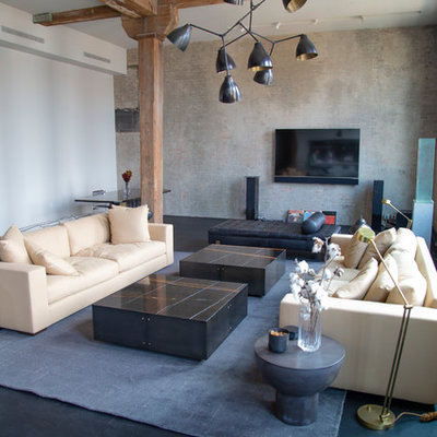 Trendy black floor living room photo in New York with gray walls and a wall-mounted tv