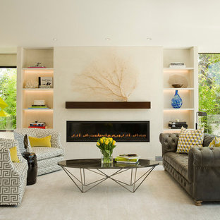 Large beach style formal and open concept light wood floor living room photo in Los Angeles with white walls, a ribbon fireplace, a plaster fireplace and no tv