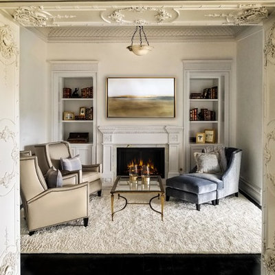 Example of a huge classic enclosed dark wood floor and black floor living room design in Los Angeles with white walls and a standard fireplace
