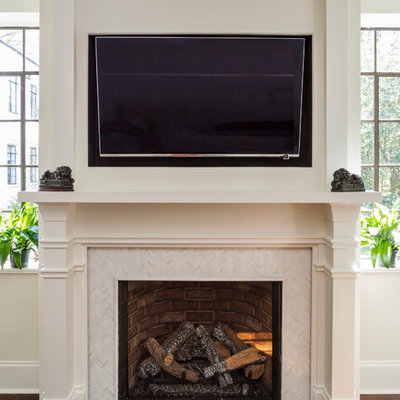 Mid-sized transitional formal and enclosed dark wood floor and brown floor living room photo in Charlotte with a standard fireplace, a tile fireplace, a wall-mounted tv and gray walls