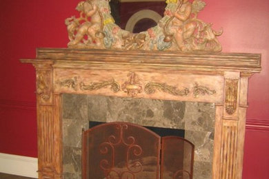 Inspiration for a living room remodel in Little Rock with red walls, a standard fireplace and a wood fireplace surround