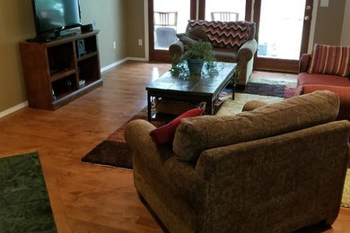 Elegant light wood floor living room photo in Boise