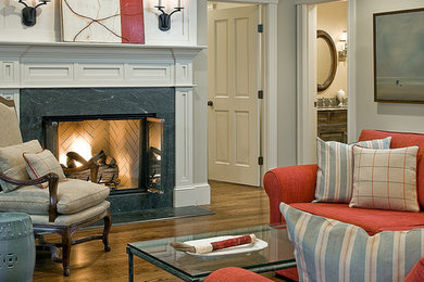 Elegant formal dark wood floor living room photo in Boston with gray walls, a standard fireplace and no tv