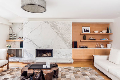 Example of a mid-sized danish formal and open concept light wood floor living room design in Toronto with white walls, a ribbon fireplace, a stone fireplace and no tv