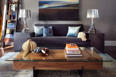 Example of a large trendy open concept dark wood floor living room design in Toronto with gray walls