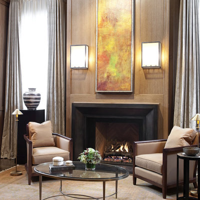 Example of a trendy living room design in Chicago with a metal fireplace and a standard fireplace