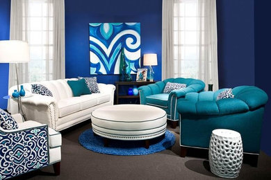 This is an example of a small contemporary enclosed living room in Boston with blue walls, carpet and brown floors.