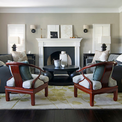 Inspiration for a large zen formal and enclosed dark wood floor living room remodel in Los Angeles with beige walls, a standard fireplace and no tv