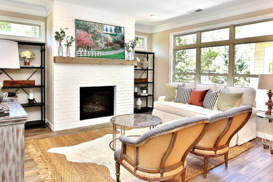 Living room - farmhouse formal medium tone wood floor and brown floor living room idea in Atlanta with beige walls, a standard fireplace, a brick fireplace and no tv