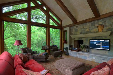 Example of a mid-sized classic formal and enclosed carpeted living room design in Detroit with gray walls, a standard fireplace, a stone fireplace and a wall-mounted tv