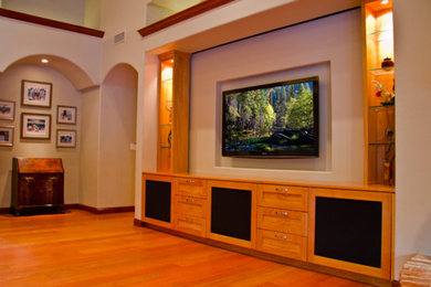 Example of a large open concept medium tone wood floor living room design in Other with beige walls, no fireplace and a wall-mounted tv