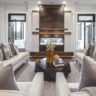 Inspiration for a transitional enclosed dark wood floor and brown floor living room remodel in Seattle with gray walls and a ribbon fireplace