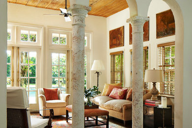 Living room - mediterranean dark wood floor living room idea in Miami with beige walls