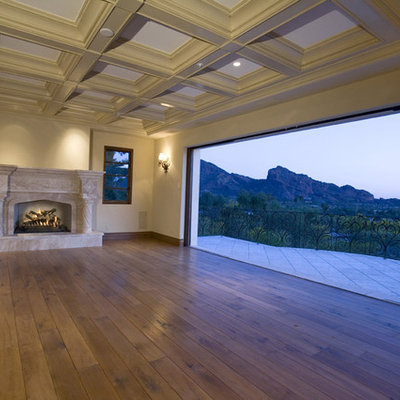 Tuscan living room photo in Phoenix with a standard fireplace