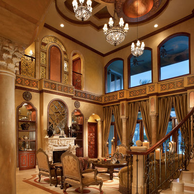 Huge tuscan formal and open concept porcelain tile and beige floor living room photo in Miami with brown walls, a standard fireplace, a plaster fireplace and no tv