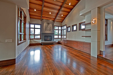 Inspiration for a large contemporary formal and open concept medium tone wood floor living room remodel in Seattle with beige walls, a standard fireplace, a stone fireplace and no tv