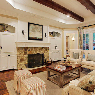 Elegant living room photo in Houston with a stone fireplace