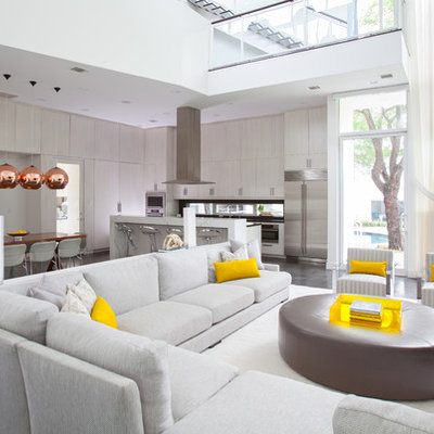 Inspiration for a contemporary open concept concrete floor living room remodel in Houston