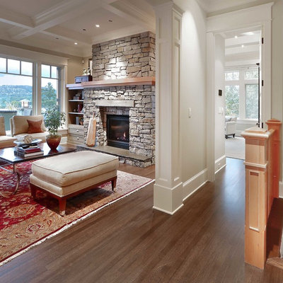 Living room - large traditional open concept and formal dark wood floor living room idea in Seattle with beige walls, a standard fireplace and a stone fireplace