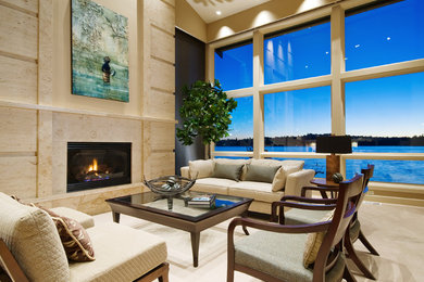 Design ideas for an expansive contemporary living room in Seattle with beige walls and a standard fireplace.