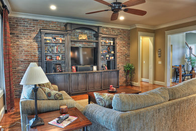 Open concept living room photo in Louisville with a wall-mounted tv