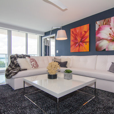 Inspiration for a contemporary living room remodel in Newark with blue walls
