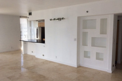 Mid-sized trendy travertine floor living room photo in Miami with white walls